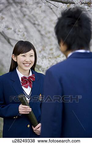 Stock Photo - High School Student Girl with Holding Diploma, Differential Focus. Fotosearch