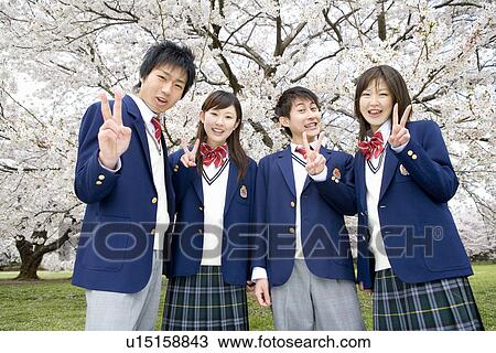 Stock Image - High School Student In Grass Field. Fotosearch