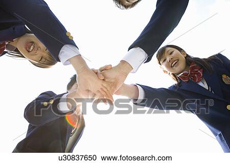 High School Student in Huddle with hands together View Large Photo Image Stock Image - High School Student in Huddle with hands together. Fotosearch
