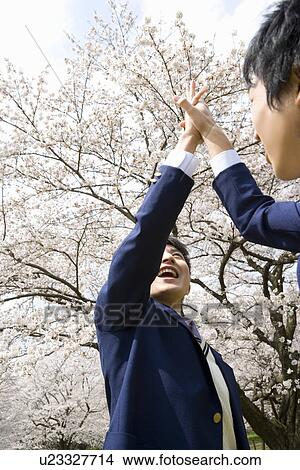 Picture - High School Students Giving Each Other High-five. Fotosearch