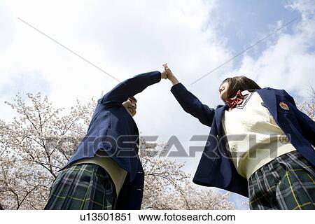 High School Students Giving Each Other High-five View Large Photo Image Stock Image - High School Students Giving Each Other High-five. Fotosearch