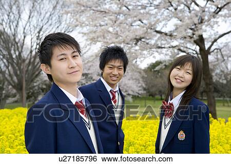 Stock Photograph - High School Students In Rape Seed Blossoms. Fotosearch