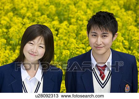 Stock Image - High School Students In The Rape Seed Blossoms, Differential Focus. Fotosearch