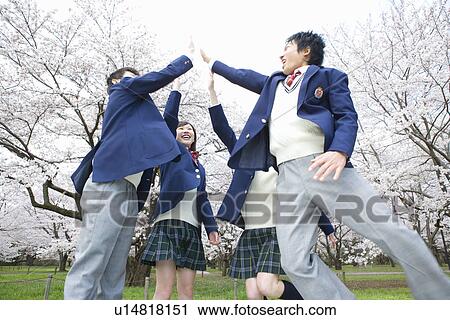 High School Students Jumping and Giving Each Other High-five View Large Photo Image Stock Image - High School Students Jumping and Giving Each Other High-five. Fotosearch