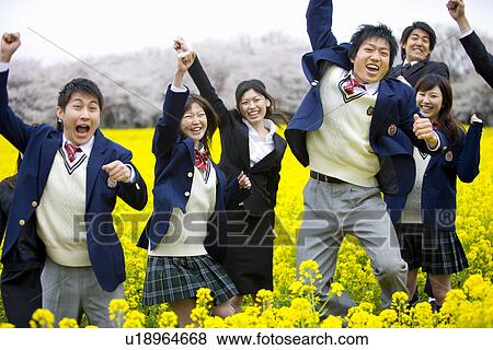 Stock Photo - High School Students Jumping In Rape Seed Blossoms. Fotosearch
