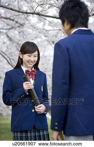 High School Students Under Cherry Blossoms with Holding Diploma View Large Photo Image Stock Photo - High School Students Under Cherry Blossoms with Holding Diploma. Fotosearch