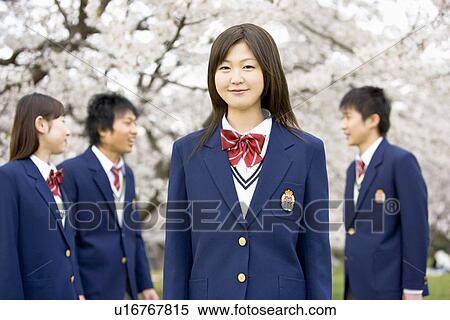 Stock Photography - High School Students Under Cherry Blossoms, Differential Focus. Fotosearch
