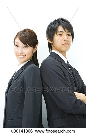Businessman And Businesswoman Standing Back To Back, Side View, Waist Up, View Large Photo Image Stock Photograph - Businessman And Businesswoman Standing Back To Back, Side View, Waist Up,. Fotosearch