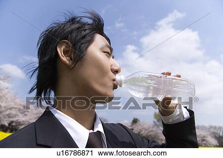 Businessman Drinking Water, Side View, Head and Shoulder View Large Photo Image Stock Image - Businessman Drinking Water, Side View, Head and Shoulder. Fotosearch