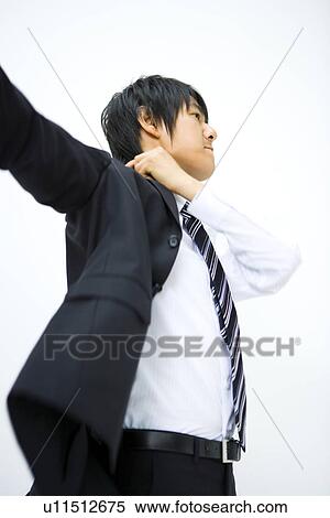 Businessman Getting a Jacket On, Side View, Waist Up View Large Photo Image Stock Photography - Businessman Getting a Jacket On, Side View, Waist Up. Fotosearch