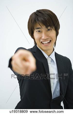 Businessman Pointing, Waist Up, Front View, Portrait, Differential Focus View Large Photo Image Stock Photo - Businessman Pointing, Waist Up, Front View, Portrait, Differential Focus. Fotosearch