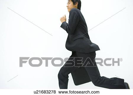 Businessman Running, Side View, Three Quarter Length, Copy Space View Large Photo Image Stock Photo - Businessman Running, Side View, Three Quarter Length, Copy Space. Fotosearch