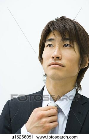 Businessman Touching His Tie, Front View, Head and Shoulder, Portrait View Large Photo Image Stock Image - Businessman Touching His Tie, Front View, Head and Shoulder, Portrait. Fotosearch