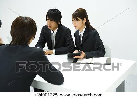 Stock Photography - Businessmen and Businesswoman In Meeting, Side View, Rear View. Fotosearch
