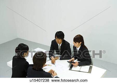 Businessmen and Businesswomen In Meeting, High Angle View View Large Photo Image Stock Photo - Businessmen and Businesswomen In Meeting, High Angle View. Fotosearch