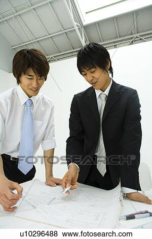 Stock Photo - Businessmen In Meeting, Front View. Fotosearch