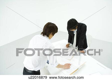 Businessmen In Meeting, High Angle View View Large Photo Image Stock Photo - Businessmen In Meeting, High Angle View. Fotosearch