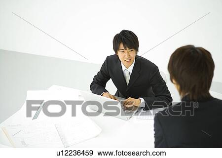 Stock Photo - Businessmen In Meeting. Fotosearch