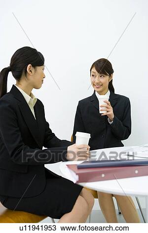 Businesswomen Talking In Office, Side View, Front View, Waist Up View Large Photo Image Stock Image - Businesswomen Talking In Office, Side View, Front View, Waist Up. Fotosearch