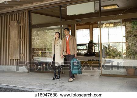 Japanese couple coming out of the Japanese inn, front view, Japan View Large Photo Image Stock Photo - Japanese couple coming out of the Japanese inn, front view, Japan. Fotosearch