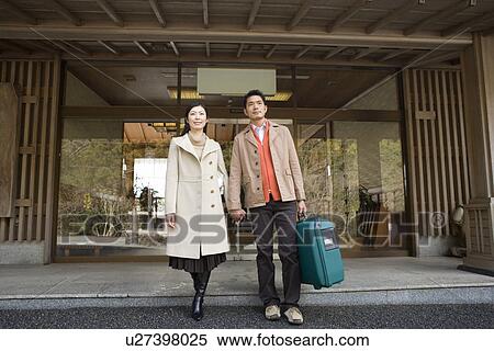Japanese couple coming out of the Japanese inn, front view, Japan View Large Photo Image Stock Photography - Japanese couple coming out of the Japanese inn, front view, Japan. Fotosearch
