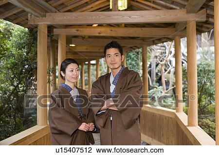 Japanese couple in Yukata at the corridor of the Japanese inn, front view, Japan View Large Photo Image Stock Image - Japanese couple in Yukata at the corridor of the Japanese inn, front view, Japan. Fotosearch
