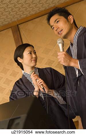 Japanese couple singing in Yukata, front view, side view, low angle view, Japan View Large Photo Image Picture - Japanese couple singing in Yukata, front view, side view, low angle view, Japan. Fotosearch
