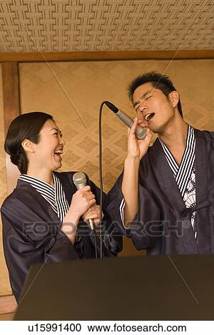 Japanese couple singing in Yukata, front view, Japan View Large Photo Image Stock Image - Japanese couple singing in Yukata, front view, Japan. Fotosearch