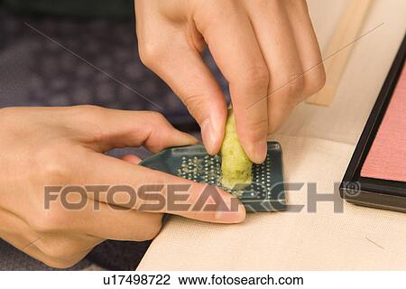 Man grating Japanese horseradish, high angle view, close up, Japan View Large Photo Image Stock Image - Man grating Japanese horseradish, high angle view, close up, Japan. Fotosearch