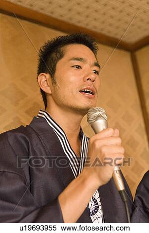 Man singing in Yukata, low angle view, Japan View Large Photo Image Stock Photography - Man singing in Yukata, low angle view, Japan. Fotosearch