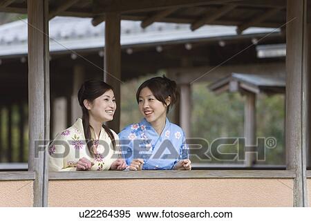 Two women in Yukata talking at the outside corridor, front view, Japan View Large Photo Image Stock Photography - Two women in Yukata talking at the outside corridor, front view, Japan. Fotosearch
