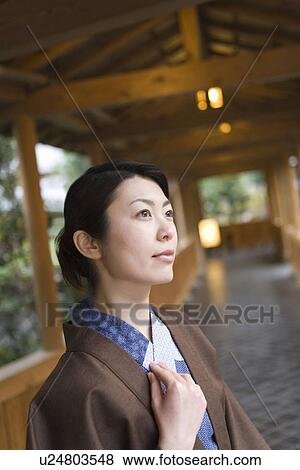 Woman in Yukata at the corridor of the Japanese inn, side view, differential focus, Japan View Large Photo Image Stock Photo - Woman in Yukata at the corridor of the Japanese inn, side view, differential focus, Japan. Fotosearch
