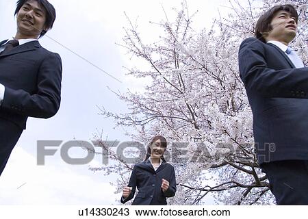 Stock Image - Businessmen and Businesswomen Running, Low Angle View, Waist Up,. Fotosearch
