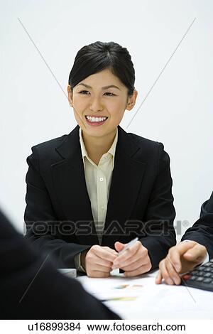 Picture - Businesswoman In Meeting. Fotosearch