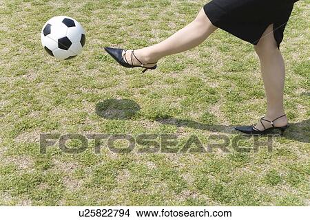 Businesswoman Kicking a Ball, Body Parts View Large Photo Image Picture - Businesswoman Kicking a Ball, Body Parts. Fotosearch