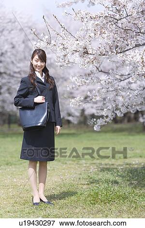 Businesswoman Standing in the Field, Smiling, Full Length, Portrait, Front View View Large Photo Image Stock Photo - Businesswoman Standing in the Field, Smiling, Full Length, Portrait, Front View. Fotosearch
