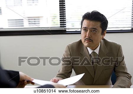 Picture - Businessman receiving document. Fotosearch