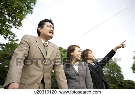 Stock Image - Portrait of three business people. Fotosearch