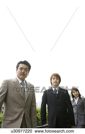 Stock Image - Portrait of three business people. Fotosearch