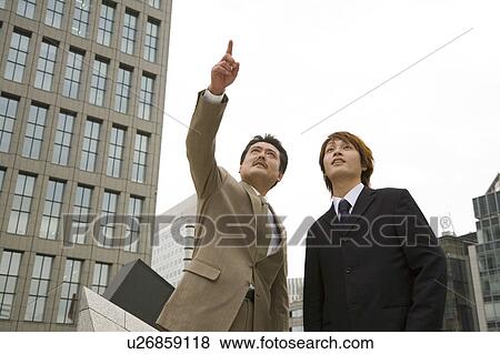 Stock Photo - Portrait of two businessmen. Fotosearch