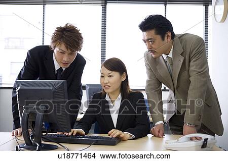 Picture - Three people working in office. Fotosearch