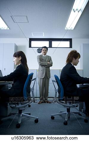 Three people working in office View Large Photo Image Stock Image - Three people working in office. Fotosearch