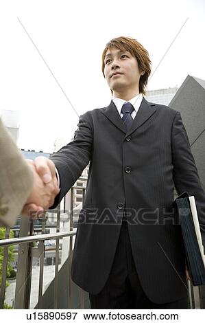 Two businessmen shaking hands View Large Photo Image Stock Photo - Two businessmen shaking hands. Fotosearch