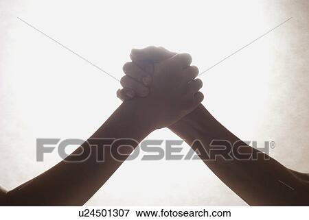 Stock Photo - Two people shaking hands. Fotosearch