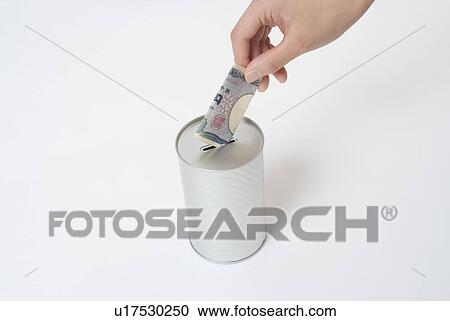 Stock Image - Woman donating money. Fotosearch
