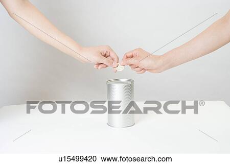 Stock Image - Women donating money. Fotosearch
