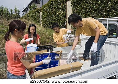 Young people collecting garbage View Large Photo Image Stock Image - Young people collecting garbage. Fotosearch