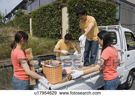 Young people collecting garbage View Large Photo Image Stock Photo - Young people collecting garbage. Fotosearch