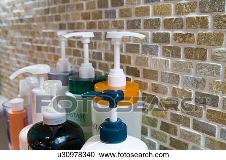 Stock Image - Hair products in hair salon. Fotosearch