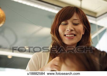 Hairdresser smiling View Large Photo Image Picture - Hairdresser smiling. Fotosearch